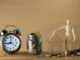 Retirement planning - photo of a clock and coins in a jar