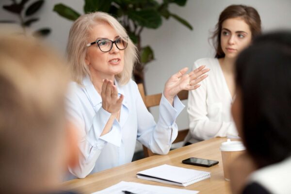 A woman talking during a work meeting