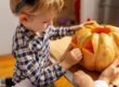 Child holding a pumpkin