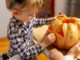 Child holding a pumpkin