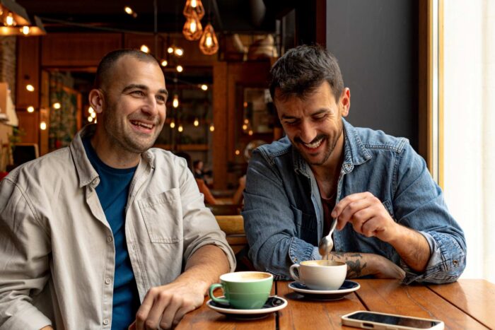 Two men talking in a café.