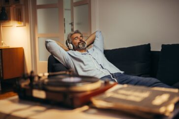 A man relaxing while listening to music independent financial planners