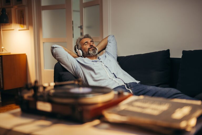 A man relaxing while listening to music independent financial planners