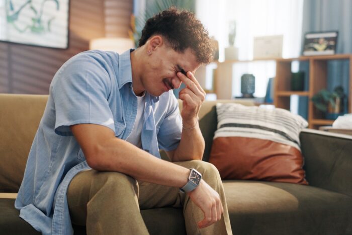 man with head in hands