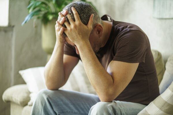 the signs of burnout - man head in hands