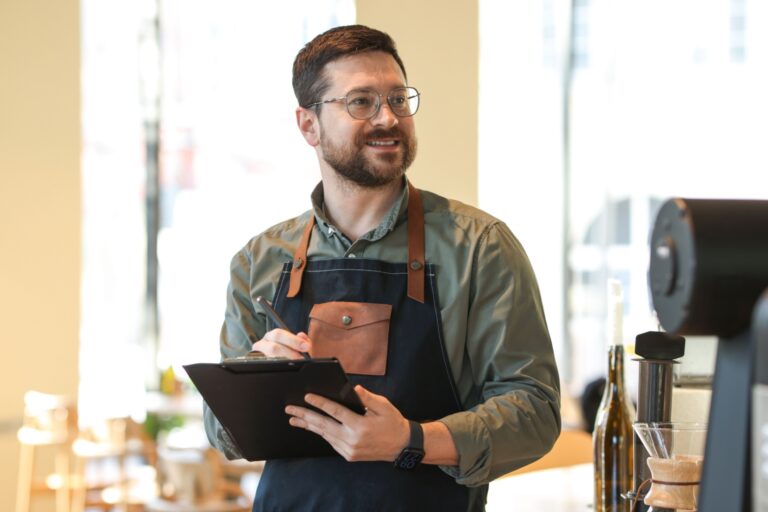 LM Financial – June 2026 (4) A business owner with a clipboard inspecting work.