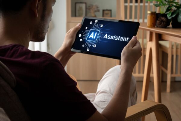LM Financial July (3) Someone using an AI assistant on a tablet.