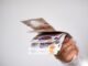 a hand holding bank notes