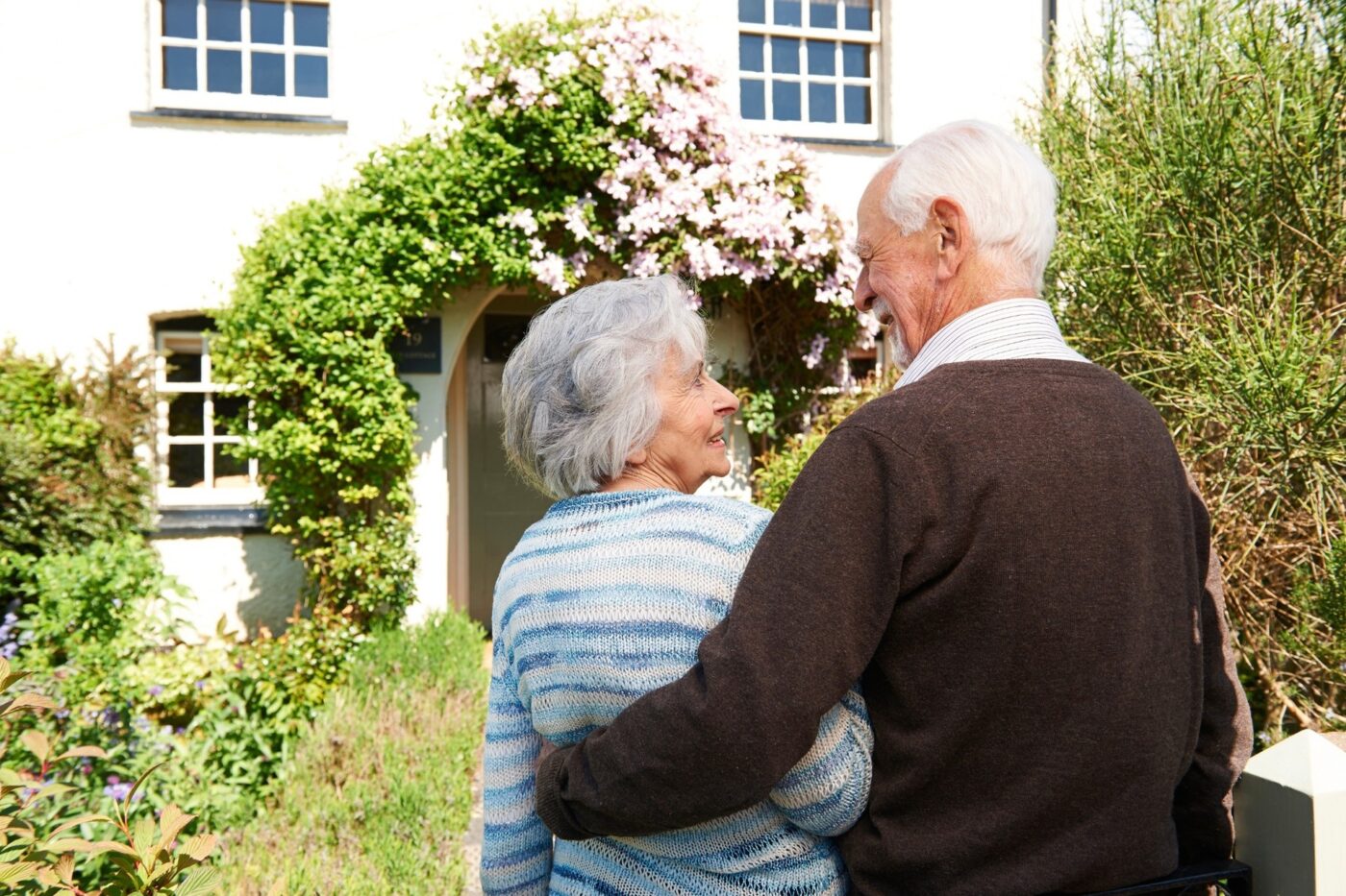 couple in front of their home