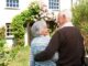 couple in front of their home